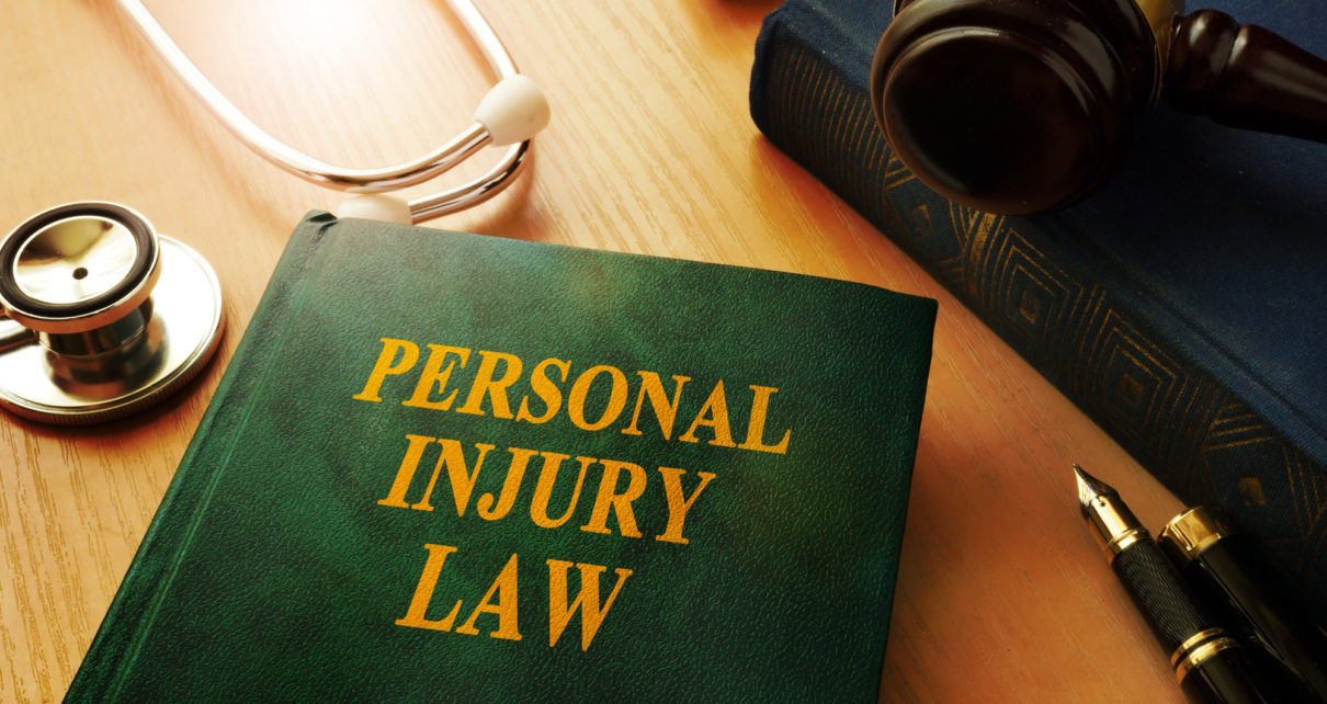Personal injury law book on a table.